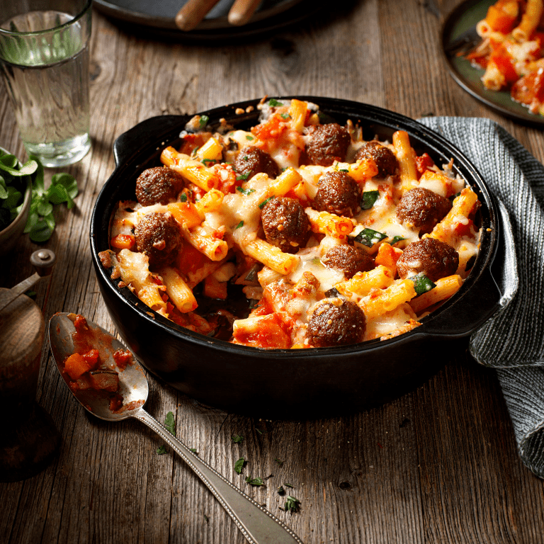 Gratinated pasta with pumpkin and veggie balls